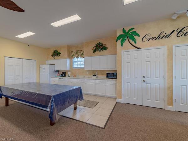 Orchid Cove At Port Of The Islands, 25065 Peacock Ln #202, Naples, Florida 34114, image 1