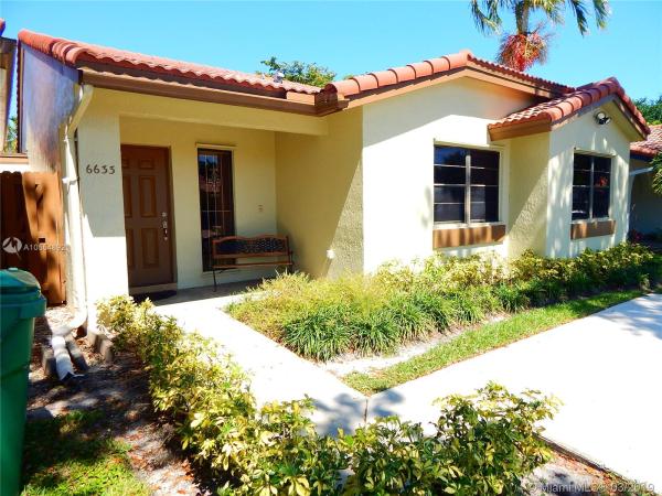 The Moors Townhouses, 6633 NW 177th Ter, Country Club, Florida 33015, image 1