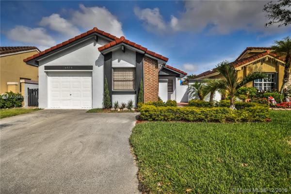 The Moors Cluster Homes, 6323 NW 173rd Ter #6223, Country Club, Florida 33015, image 2