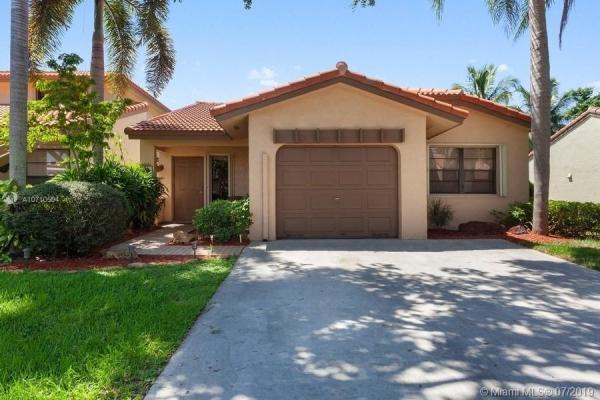 The Moors Townhouses, 17811 NW 66th Court Cir, Country Club, Florida 33015, image 2
