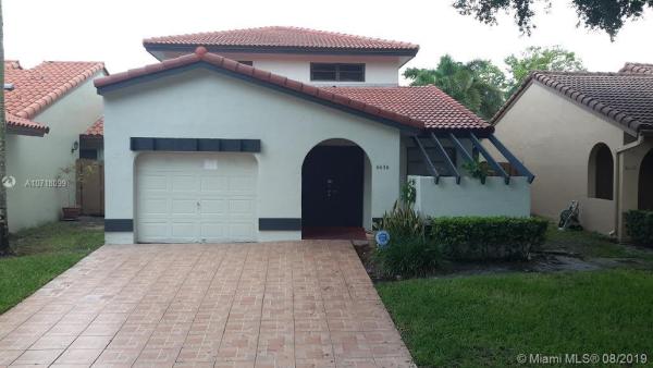 The Moors Townhouses, 6636 NW 178th Ter, Country Club, Florida 33015, image 2