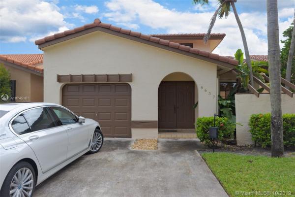 The Moors Townhouses, 6637 NW 176th Ter, Country Club, Florida 33015, image 2