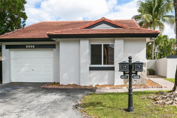 The Moors Cluster Homes, 6237 NW 176th Ter, Country Club, Florida 33015, image 2