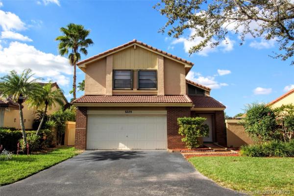 The Moors Cluster Homes, 6229 NW 181st Ter, Country Club, Florida 33015, image 2
