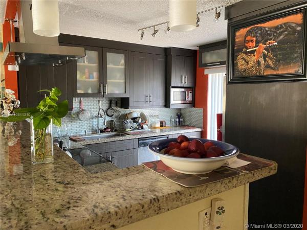 The Moors Townhouses, 17918 NW 66th Ct Cir, Country Club, Florida 33015, image 2