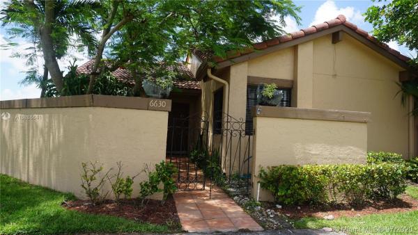 The Moors Townhouses, 6630 NW 180th Ter, Country Club, Florida 33015, image 2