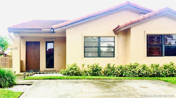 The Moors Townhouses, 6642 NW 177th Ter, Country Club, Florida 33015, image 2