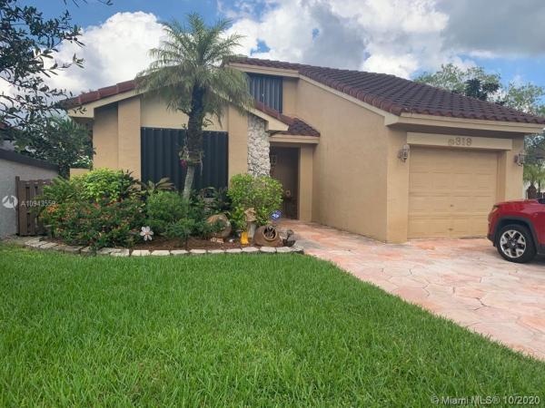 The Moors Cluster Homes, 6319 NW 173rd Ter, Country Club, Florida 33015, image 2