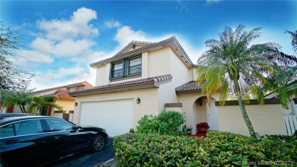 The Moors Cluster Homes, 17324 NW 63rd Ave, Country Club, Florida 33015, image 2