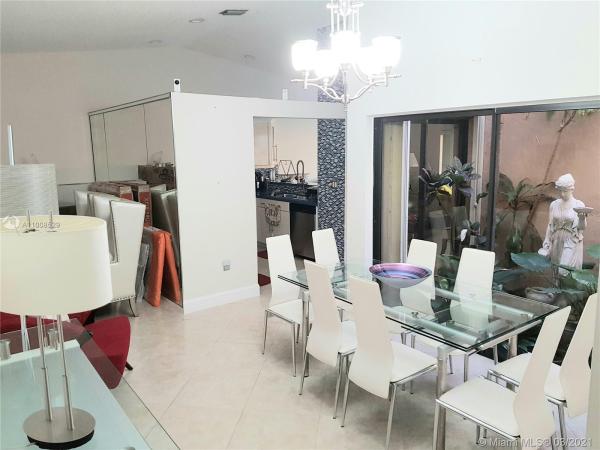 The Moors Townhouses, 6633 NW 175th Ter #6633, Country Club, Florida 33015, image 2