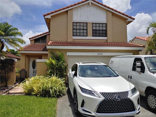 The Moors Cluster Homes, 6228 NW 181st Ter, Country Club, Florida 33015, image 2