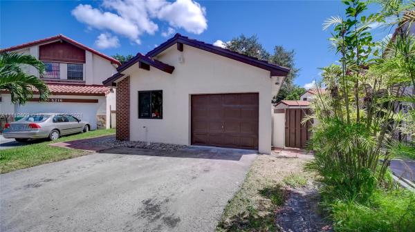 The Moors Cluster Homes, 6220 NW 179th Ter, Country Club, Florida 33015, image 2