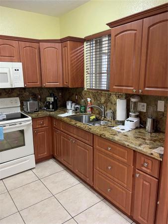 Tropical Landings, 7250 NW 174th Ter #104, Country Club, Florida 33015, image 2