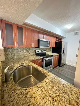 Villa Rustica, 18880 NW 57 Ave #106, Country Club, Florida 33015, image 2
