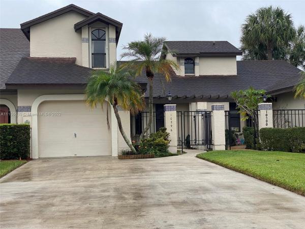 Valencia Townhomes, 10296 SW 137th Ct, The Hammocks, Florida 33186, image 1