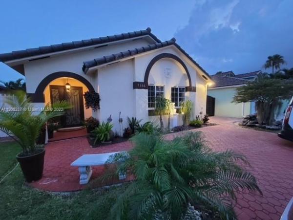 Turtle Run Estates, 7666 NW 168th Ter, Country Club, Florida 33015, image 1