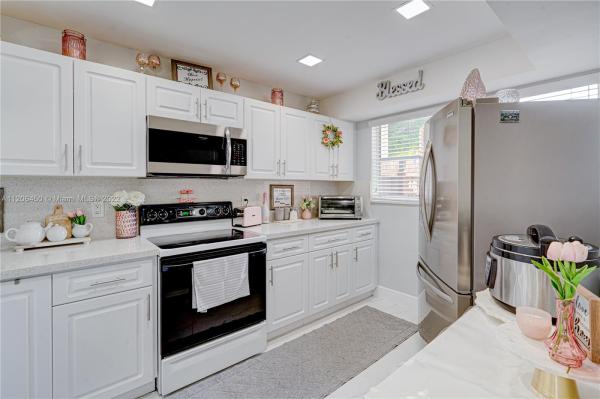 Ludlum Lake Townhouses 2, 7110 NW 169th St #7110, Country Club, Florida 33015, image 1