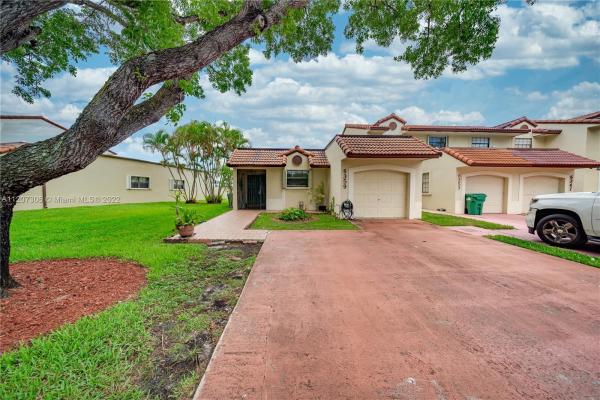 Townhomes Of Country Lake, 6359 NW 190th Ter, Country Club, Florida 33015, image 1