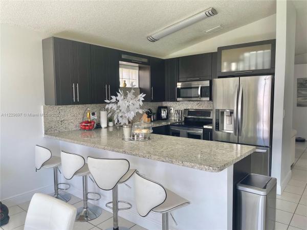 Turtle Run Estates, 7617 NW 166th Ter, Country Club, Florida 33015, image 1