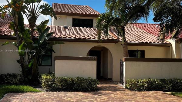 The Moors Townhouses, 6644 NW 181st Ter, Country Club, Florida 33015, image 1