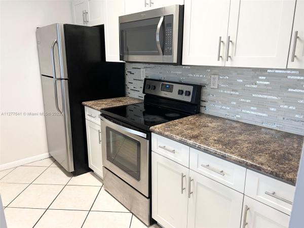Las Brisas Country Club Of Miami, 7035 NW 186th St #D305, Country Club, Florida 33015, image 1