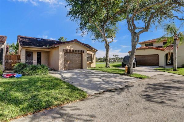 The Moors Townhouses, 17435 NW 66th Ct, Country Club, Florida 33015, image 1
