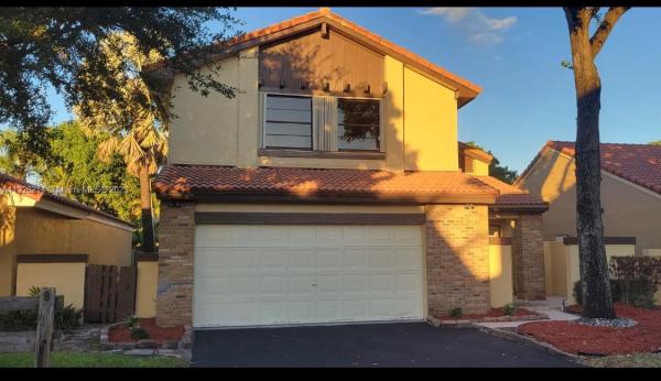 The Moors Cluster Homes, 6317 NW 174th Ter, Country Club, Florida 33015, image 2