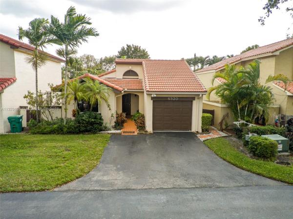 The Moors Cluster Homes, 6320 NW 180th Ter, Country Club, Florida 33015, image 1