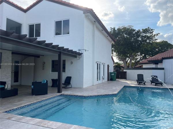 The Moors Cluster Homes, 6305 NW 174th Ter, Country Club, Florida 33015, image 1