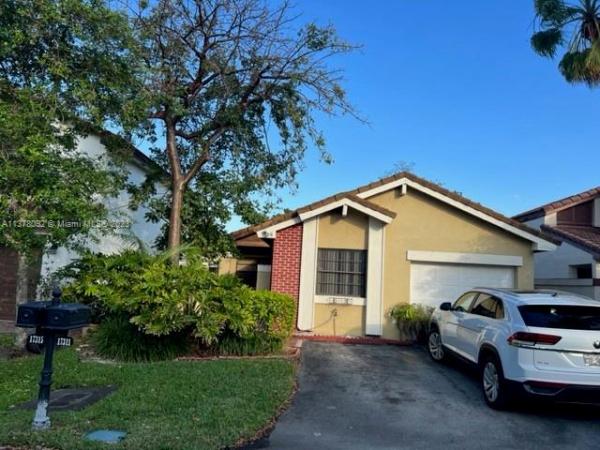 The Moors Cluster Homes, 17311 NW 63rd Ct, Country Club, Florida 33015, image 1