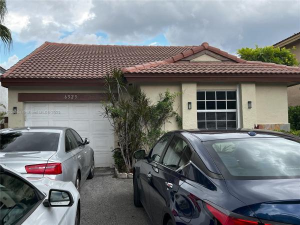 The Moors Cluster Homes, 6325 NW 181st Ter, Country Club, Florida 33015, image 1