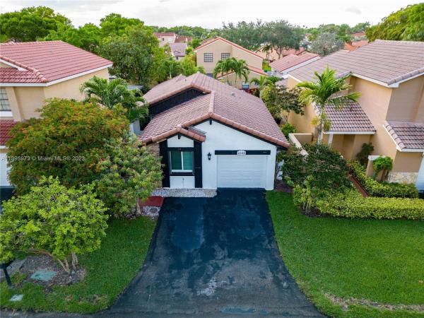 The Moors Cluster Homes, 6321 NW 180th Ter, Country Club, Florida 33015, image 1