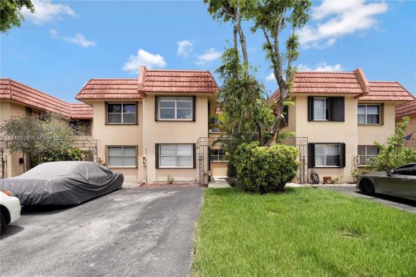 Ludlum Lake Townhouses 2, 7016 NW 169th St #7016, Country Club, Florida 33015, image 1