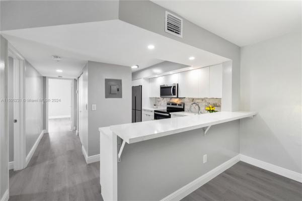 Villa Rustica, 18840 NW 57th Ave #201, Country Club, Florida 33015, image 1