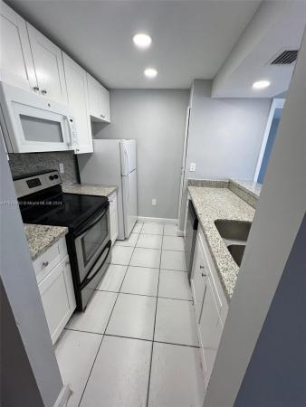 Las Brisas Country Club Of Miami, 7035 NW 186th St #D509, Country Club, Florida 33015, image 1