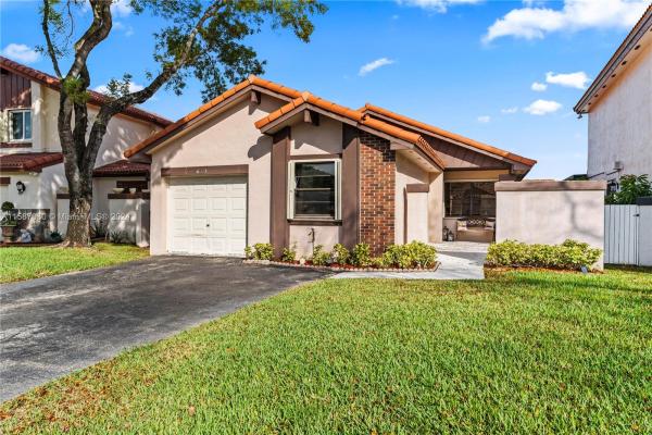 The Moors Cluster Homes, 6331 NW 181st Ter, Country Club, Florida 33015, image 1