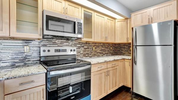 Villa Rustica, 18870 NW 57th Ave #303, Country Club, Florida 33015, image 1