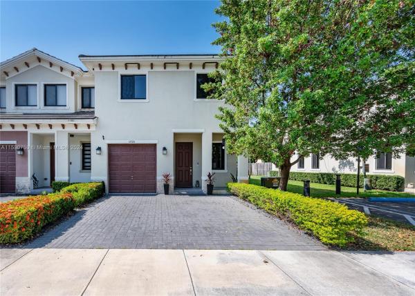 Hidden Lake Townhomes, 12720 SW 131st Ter, Three Lakes, Florida 33186, image 1