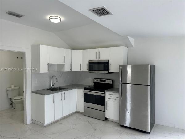 Johnson & Lostrum, 3102 NW 70th Ter, Gladeview, Florida 33147, image 2