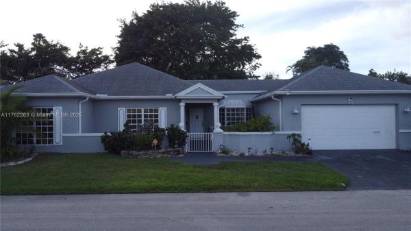 The Woodlands, 4511 Queen Palm Ln, Tamarac, Florida 33319, image 1
