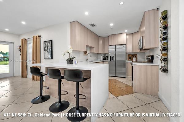 Collier Estates, 411 NE 58th Ct, Oakland Park, Florida 33334, image 1