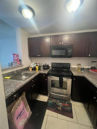 482 NW 165th St Rd #A203, Unincorporated Dade County, Florida 33169, image 1