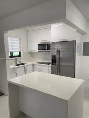Courtyards Of The Grove, 2930 Day Ave #N104, Miami, Florida 33133, image 1