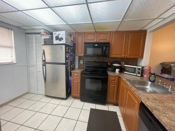 911 NE 209 Ter 106, Unincorporated Dade County, Florida 33179, image 1