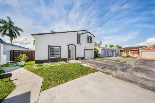 Country Lake Homes, 18858 NW 63rd Court Cir, Country Club, Florida 33015, image 2