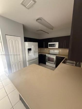 Precious Homes At Twin Lakes, 14362 SW 136th Ave, Three Lakes, Florida 33186, image 2