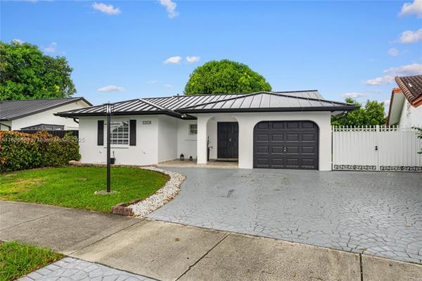 Munne Royal Homes, 14319 SW 100th Ln, The Hammocks, Florida 33186, image 2