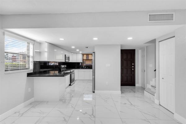 Carmel Townhomes, 5061 W 12th Ln #., Hialeah, Florida 33012, image 1