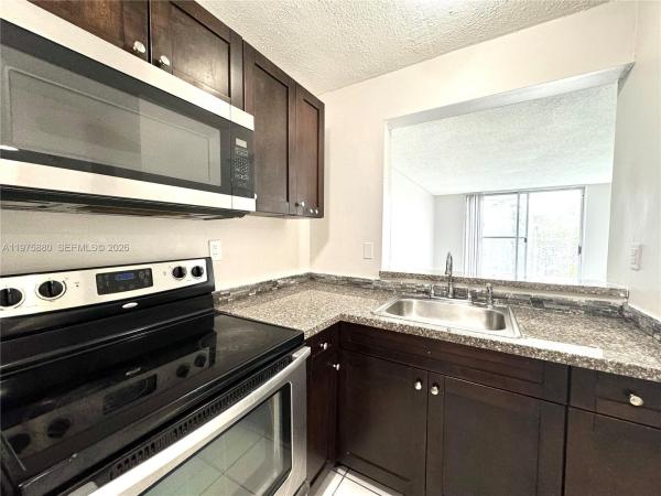 484 NW 165th St Rd #A-411, Unincorporated Dade County, Florida 33169, image 1