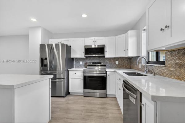 Villas At Carriage Hills Lakeside, 275 Gate Rd #104, Hollywood, Florida 33024, image 1